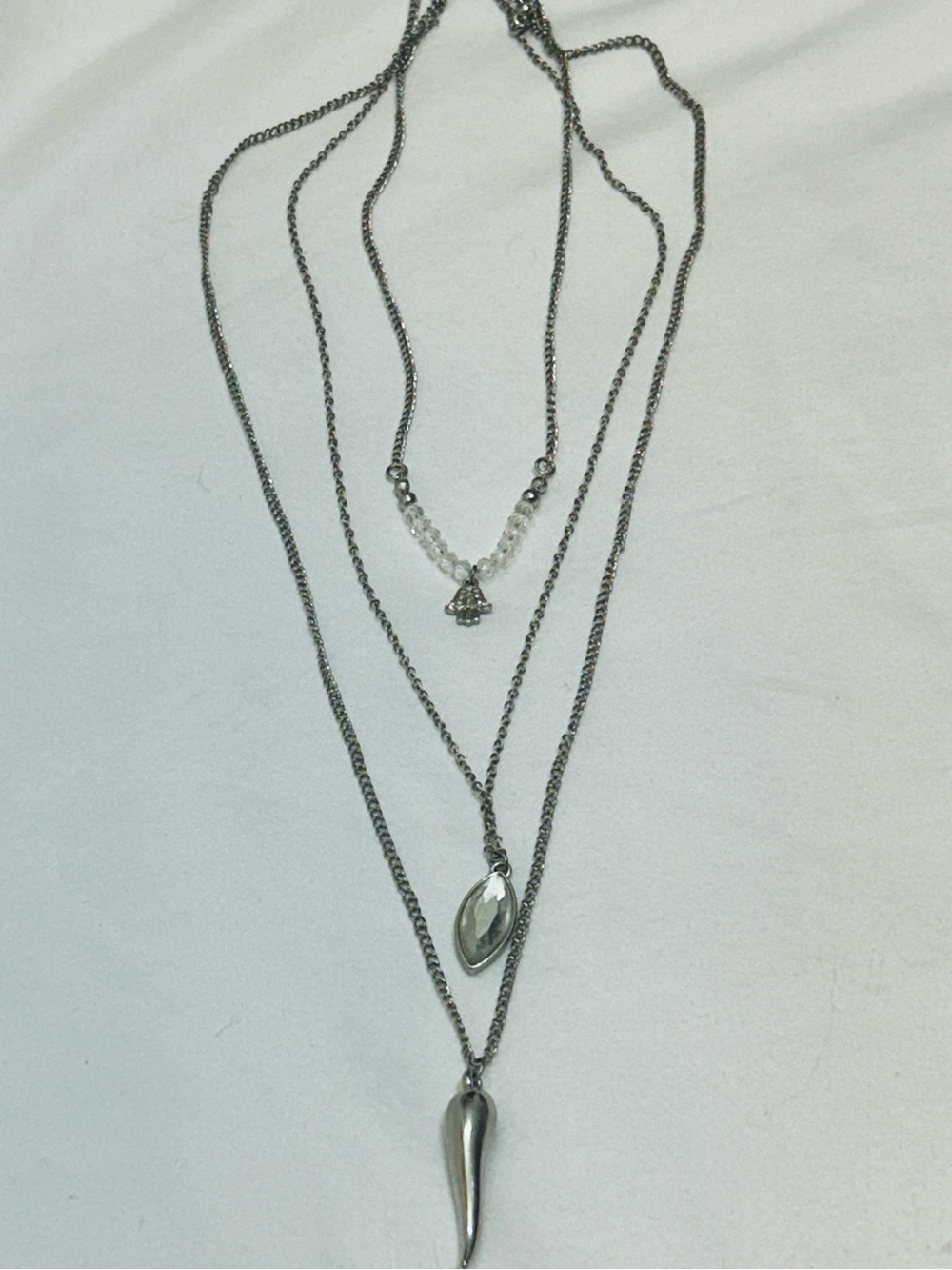 Triple-Layer Silver-Tone Womenโs Necklace with Pendant Drops